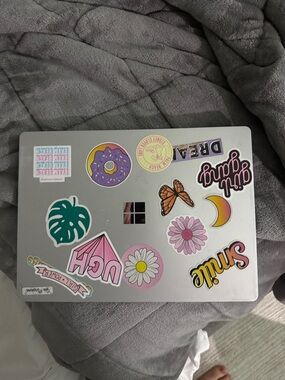 Silver Laptop with Colorful Sticker Collage